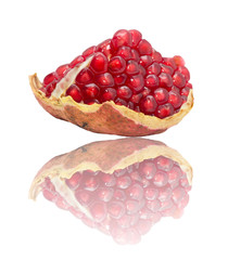 pomegranate with reflection on white background
