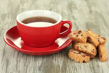 Cup of tea with cookies on table close-up