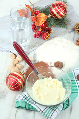 Cooking Christmas cookies on wooden table