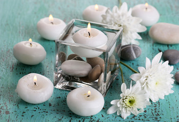 Decorative vase with candles, water and stones