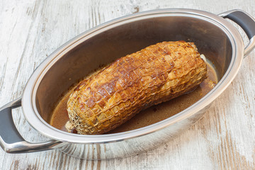 Freshly grilled meat roulade in a frying pan