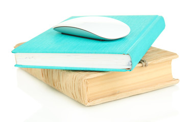 Computer mouse on books isolated on white