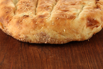 Pita bread on wooden background
