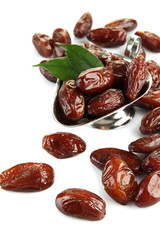 Dried dates in metal dish isolated on white
