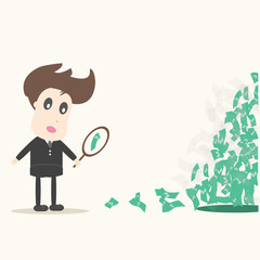 businessman looking on dollar through magnifying glass