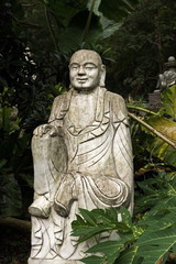Fototapeta na wymiar Ruined statue Ksitigarbha Bodhisattva