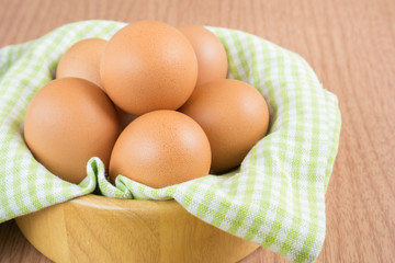 Eggs in wooden bowl