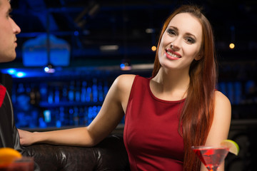 Fototapeta na wymiar Portrait of an attractive woman in a nightclub
