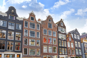 Fototapeta premium Amsterdam and typical houses with clear summer sky.Netherlands
