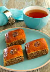 Homemade baklava with a cup of tea.