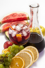 cold sangria with ice and various fruits