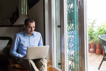 elegant business multitasking multimedia man at home