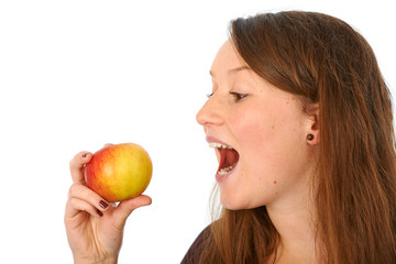 young woman is biting in a apple