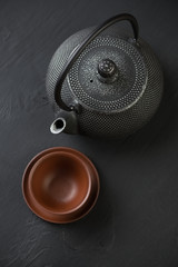 Japanese teapot and pialat, vertical shot, view from above