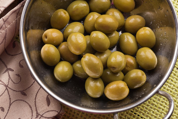 Green olive in bowl