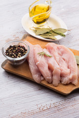 Fresh chicken on wooden table