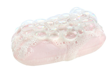 Soap and soap bubbles on white background