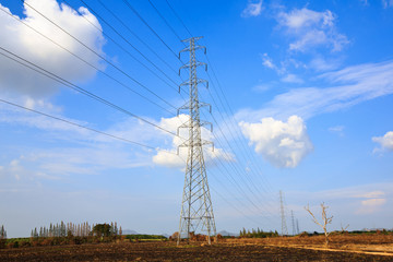 electric high voltage power post with blue sky