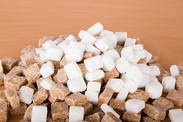 Fototapeta na wymiar Brown and white sugar cubes