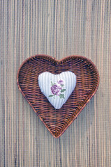 decorative cloth heart in wicker basket