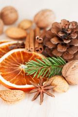 Different kinds of nuts, spices and dried oranges