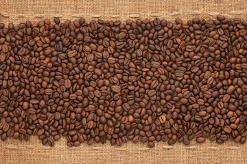 Coffee beans lying on sackcloth