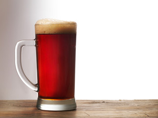 Frosty mug of dark beer