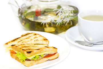 sandwich with tea on a white background in restaurant