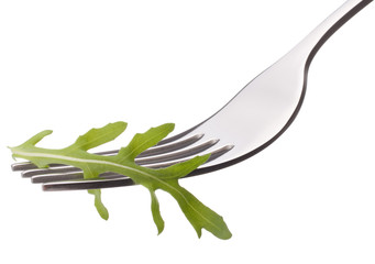 Fresh rucola  salad on fork isolated on white background cutout.