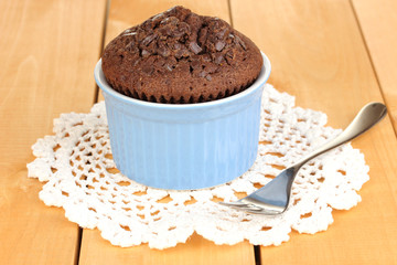 Cupcake in bowl for baking on wooden table