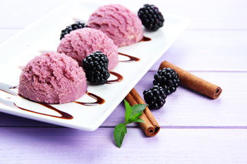 Delicious ice cream on plate on table close-up