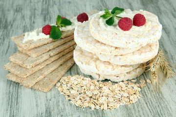 Tasty crispbread with berries, on wooden table