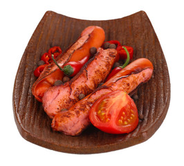 Delicious sausages on plate isolated on white