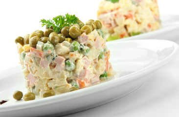 Russian traditional salad Olivier, isolated on white