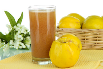 Sweet quince with juice on table on white background