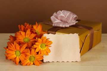 Gift box with blank label and flowers