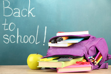 Purple backpack with school supplies