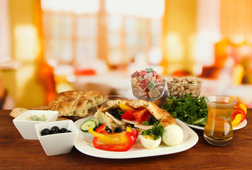 Traditional Turkish breakfast on table on bright background