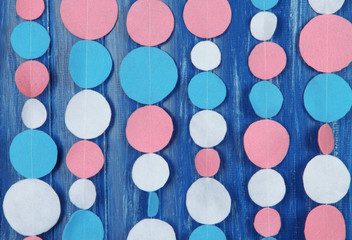 Decorative felt garland on wooden background