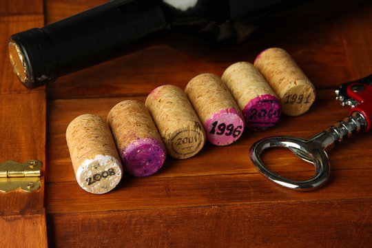 Wine corks with corkscrew on wine boxes close-up