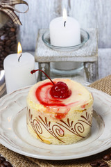 Round vanilla torte with cherry