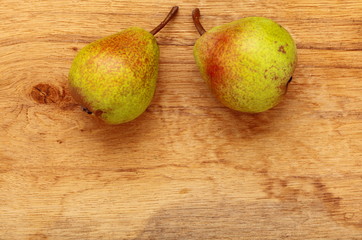 two pears fruits on wooden table background