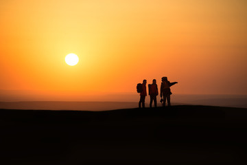 Fototapeta na wymiar three hikers and chaoyang