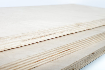 three light plywood boards stacked