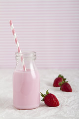 Strawberry milk in retro bottle vertical