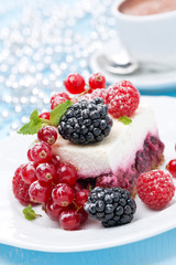 dessert - a piece of cake with fresh berries and coffee