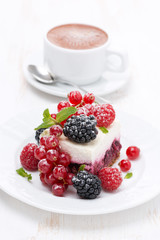 piece of cake with fresh berries and coffee