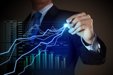 Business man drawing graphics