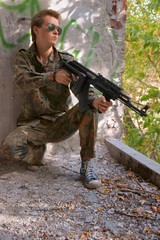 Teenager, boy in battle dress and a rifle, Air Soft Gun