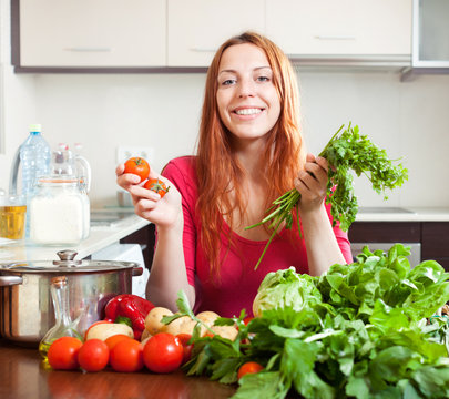 woman with  vegetables   in kitchen